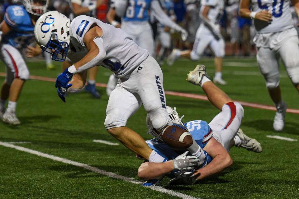 Lincoln's Brycen Mitchell (52) tackles an O'Gorman player on Friday, Sept. 22, 2023 at Howard Wood Field in Sioux Falls, South Dakota.