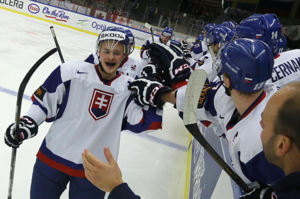Slovakia's David Griger celebrates his goal against Canada during the second period of their IIHF World Junior Championship ice hockey game in Malmo, Sweden, December 30, 2013. REUTERS/Alexander Demianchuk (SWEDEN - Tags: SPORT ICE HOCKEY)