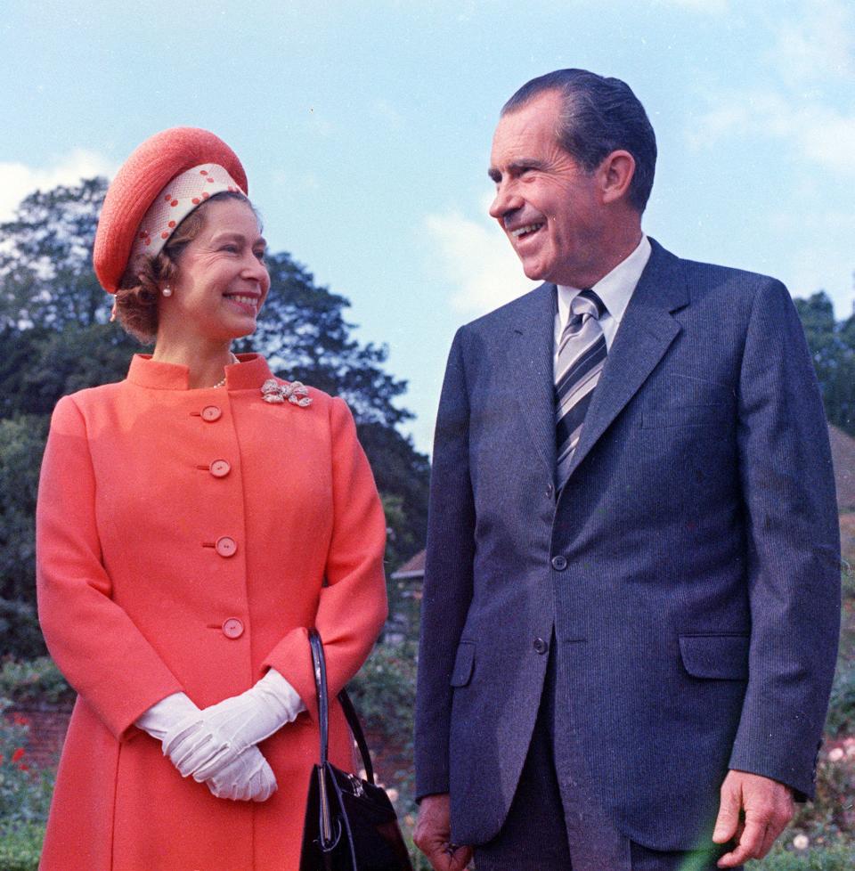 In this 1970 file photo, Britain's Queen Elizabeth II, left, reacts with U.S. President Richard Nixon, at Chequers,  in Buckinghamshire, England. The 92-year-old monarch has met every U.S. president since Dwight Eisenhower with the exception of Lyndon Johnson, who never visited Britain while in office.
