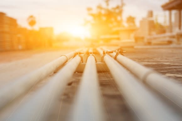 A burst of sunlight shining on a pipeline.