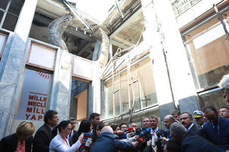 U.S. Defense Secretary Ash Carter, accompanied by Turkey's Defense Minister Fikri Isik, visits Turkish Parliament which was partly damaged during the July 15 coup attempt, in Ankara, Turkey, October 21, 2016. REUTERS/Adem Altan/Pool