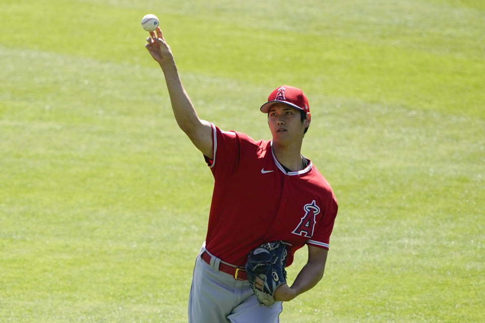 Los Angeles Angels designated hitter Shohei Ohtani (17) pitches during a baseball practice at Angels Stadium on Friday, July 3, 2020, in Anaheim, Calif. (AP Photo/Ashley Landis)
