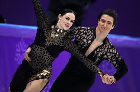 Figure Skating - Pyeongchang 2018 Winter Olympics - Ice Dance short dance competition - Gangneung Ice Arena - Gangneung, South Korea - February 19, 2018 - Tessa Virtue and Scott Moir of Canada perform. REUTERS/Phil Noble