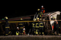 Rescuers search an overturned train in Yilan, Taiwan October 21, 2018. REUTERS/Lee Kun Han