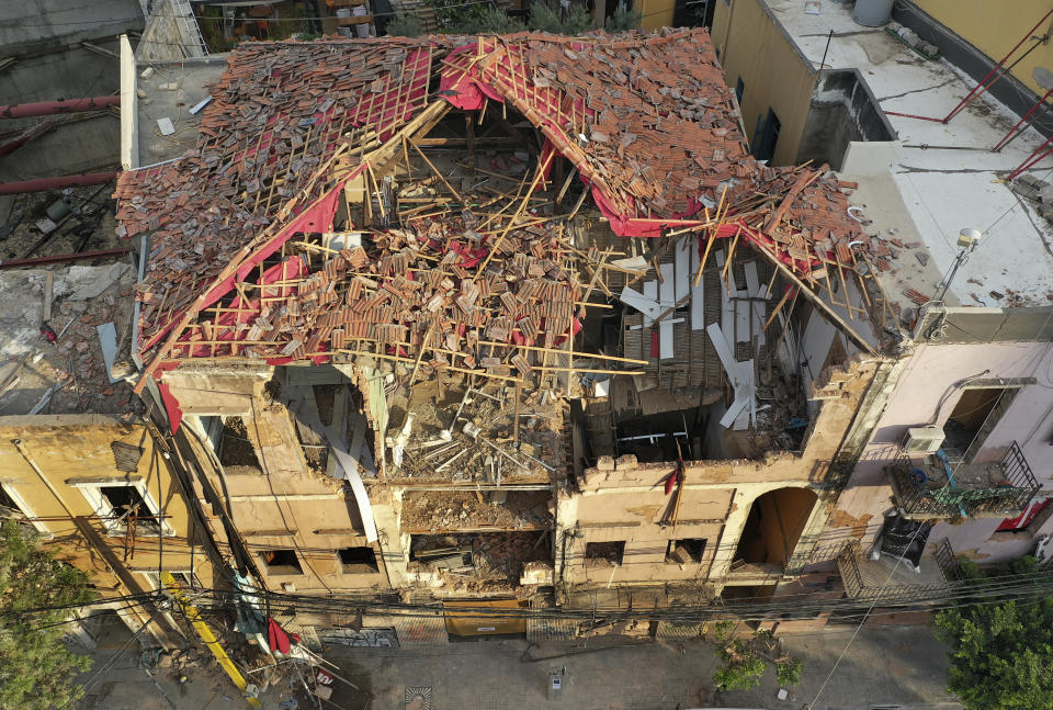 This Thursday, Aug. 27, 2020 photo shows a heritage house that was destroyed by Aug. 4 explosion that hit the seaport of Beirut, Lebanon. In the streets of Beirut historic neighborhoods, workers are erecting scaffolding to support buildings that have stood for more than a century - now at risk of collapse after the massive Aug. 4 explosion that tore through the capital. (AP Photo/Hussein Malla)