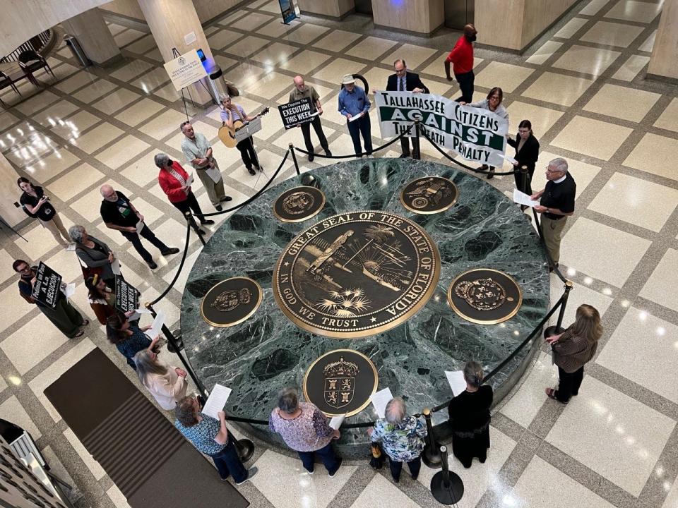 Whenever Florida executes an inmate, death penalty opponents hold prayer vigils at the Great Seal of the State of Florida at the Capitol's front door. This vigil took place on Feb. 24 after Donald Dillbeck was executed by the state.