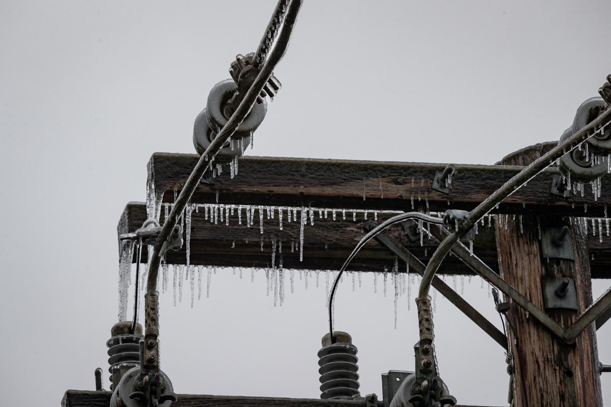 Icicles cling to a utility pole in Springfield during the winter storm on Saturday.