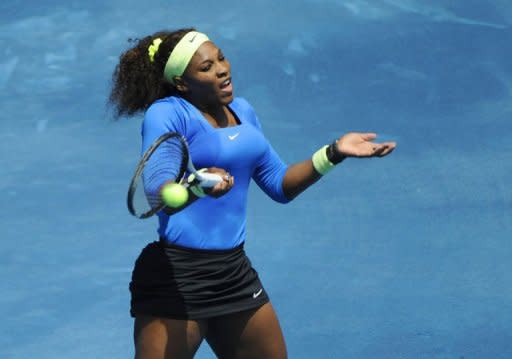 American Serena Williams returns a ball to Russia's Maria Sharapova during their match of the Madrid Masters. Williams won 6-1, 6-3