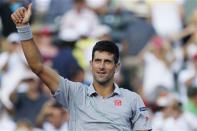 Mar 26, 2014; Miami, FL, USA; Novak Djokovic waves to the crowd after his match against Andy Murray (not pictured) on day ten of the Sony Open at Crandon Tennis Center. Geoff Burke-USA TODAY Sports