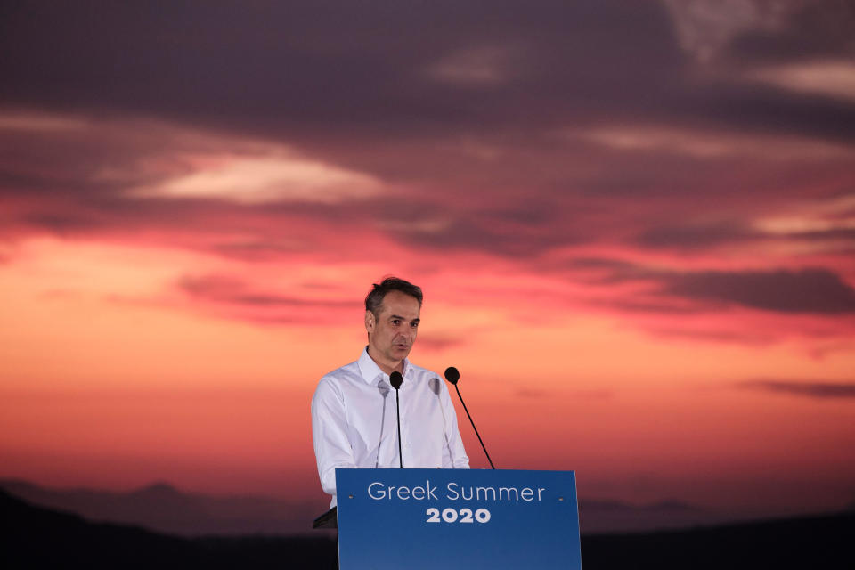 In this photo provided by the Prime Minister's Office, Greek Prime Minister Kyriakos Mitsotakis announces the opening of the tourist season during a news conference, on the Greek island of Santorini, Saturday, June 13, 2020. (Dimitris Papamitsos/Greek Prime Minister's Office via AP)