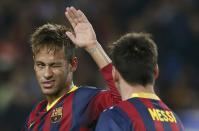 Barcelona's Neymar (L) winks his eye as he congratulates team mate Lionel Messi after scoring a penalty against AC Milan during their Champions League soccer match at Nou Camp stadium in Barcelona November 6, 2013. REUTERS/Albert Gea (SPAIN - Tags: SPORT SOCCER)