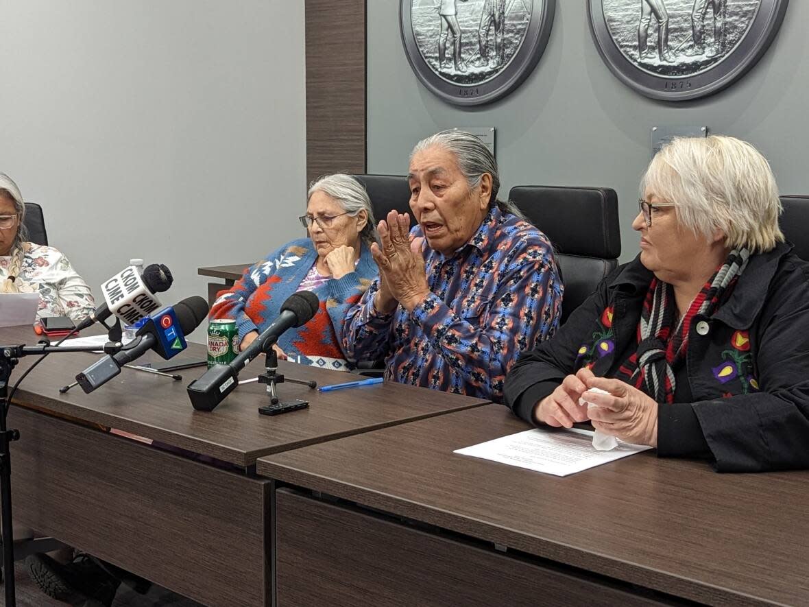 Makwa Sahgaiehcan First Nation Elder Doug Morningchild, centre right, speaks about a 2021 raid of his home during a Federation of Sovereign Indigenous Nations news conference on Friday. (Dayne Patterson/CBC - image credit)