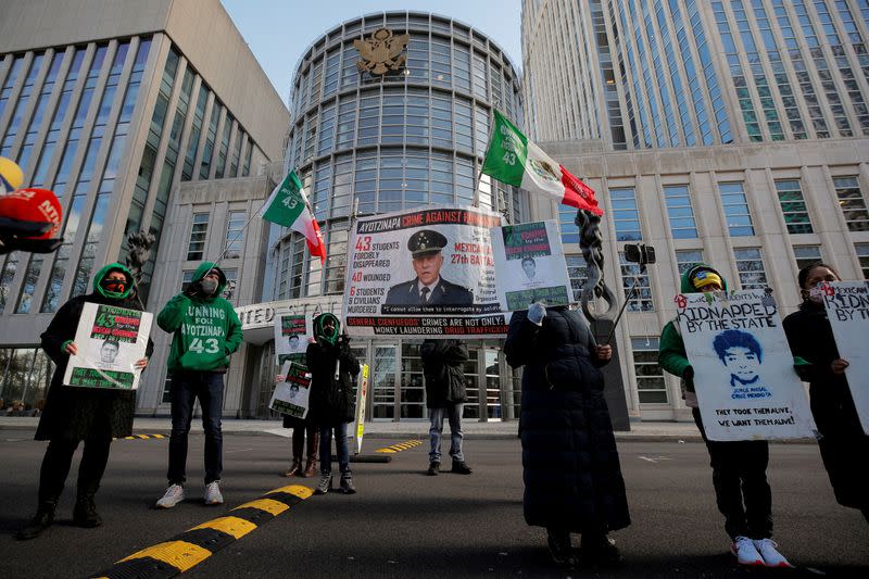 FILE PHOTO: People protest outside the Brooklyn Federal Courthouse over the decision to drop drug charges against Mexico's former defense Minister General Salvador Cienfuegos, in Brooklyn, New York