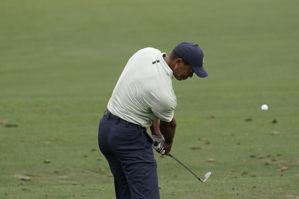 Tiger Woods hits on the driving range during a practice round for the Masters golf tournament on Tuesday, April 5, 2022, in Augusta, Ga. (AP Photo/Charlie Riedel)