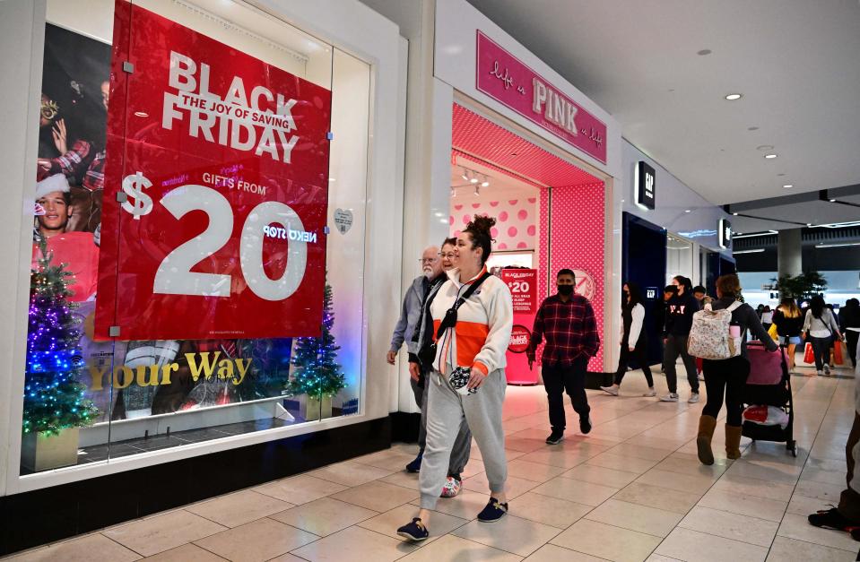 A record number of consumers shopped over Black Friday and Cyber Monday but they spent less than in prior years according to data.