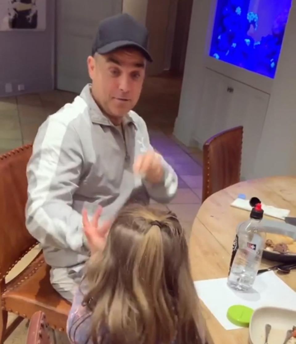 Competition: Teddy rapping with her dad Robbie Williams at the dinner table (Instagram/ Ayda Field)