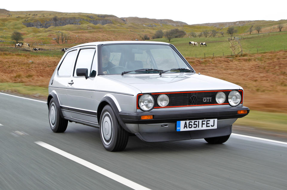 <p>It was only fair that the Mk1 Golf GTI had its place on our list due to its sure-footed stability and nerve-holding stance when it came to bigger rear-wheel drive cars of the same era. In comparison to the normal Golf, Volkswagen gave the GTI stiffer suspension (both dampers and springs), anti-roll bars and they dropped it 20mm closer to the road. Its unassisted steering offered plenty of feedback and the car could make decent pace down a B-road thanks to its 840kg weight and 110bhp on tap – helping to start a legend that, with blips along the way, continues to this day.</p>