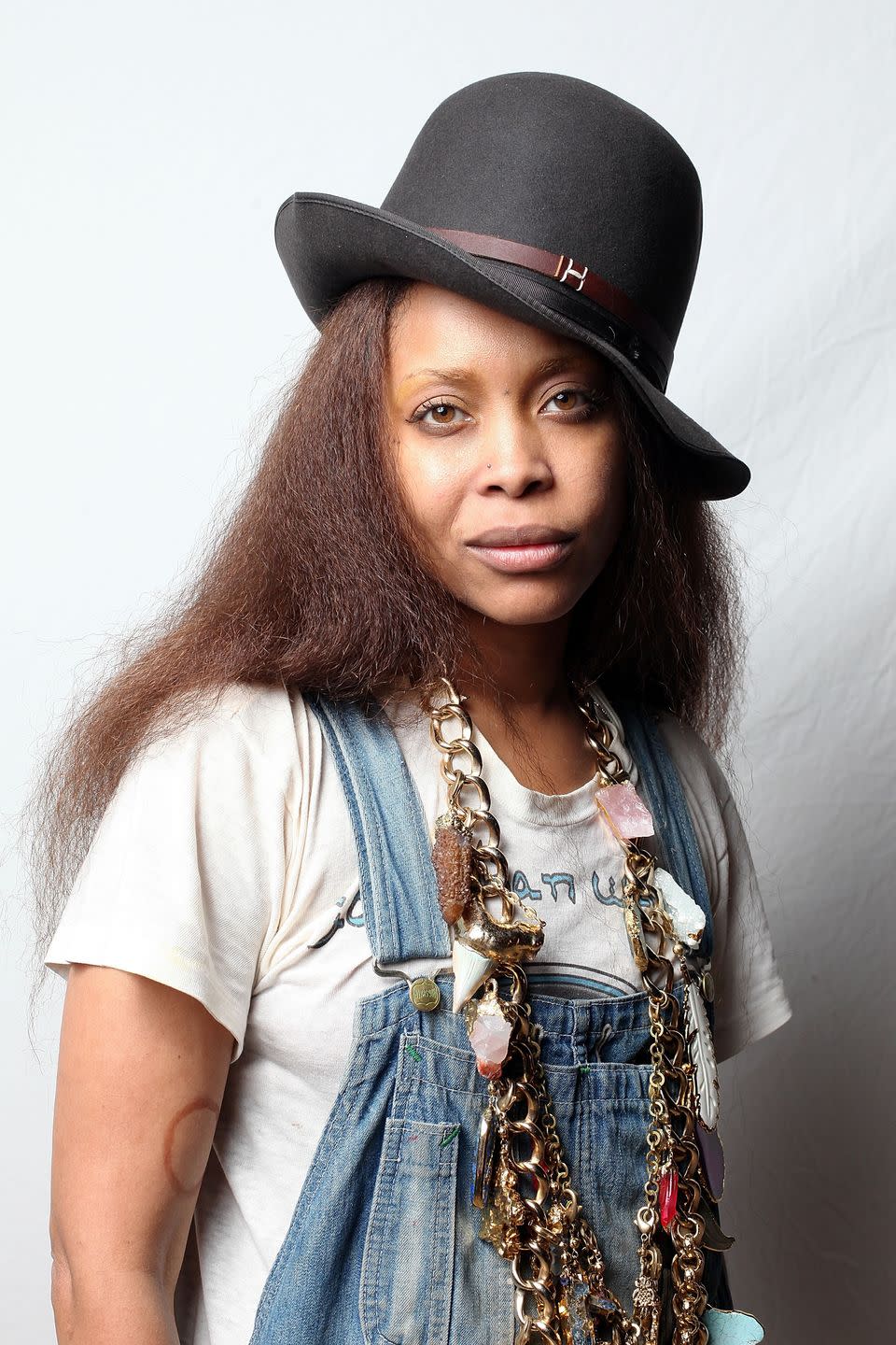 <p><strong>Born</strong>: Erica Abi Wright<br></p><p>When Badu was young, she decided to change the spelling of her first name, as she <a href="http://thesource.com/2012/02/27/blackhistorymonththesourcecelebrateserykahbadu/" rel="nofollow noopener" target="_blank" data-ylk="slk:believed the original spelling;elm:context_link;itc:0;sec:content-canvas" class="link ">believed the original spelling</a> to be a "slave name," into "Erykah." </p><p>"Kah" signified the inner self. She also picked up "Badu," as it doubled as her favorite jazz scat sound and an African name for the 10th born child of the Akan people in Ghana.<br></p>