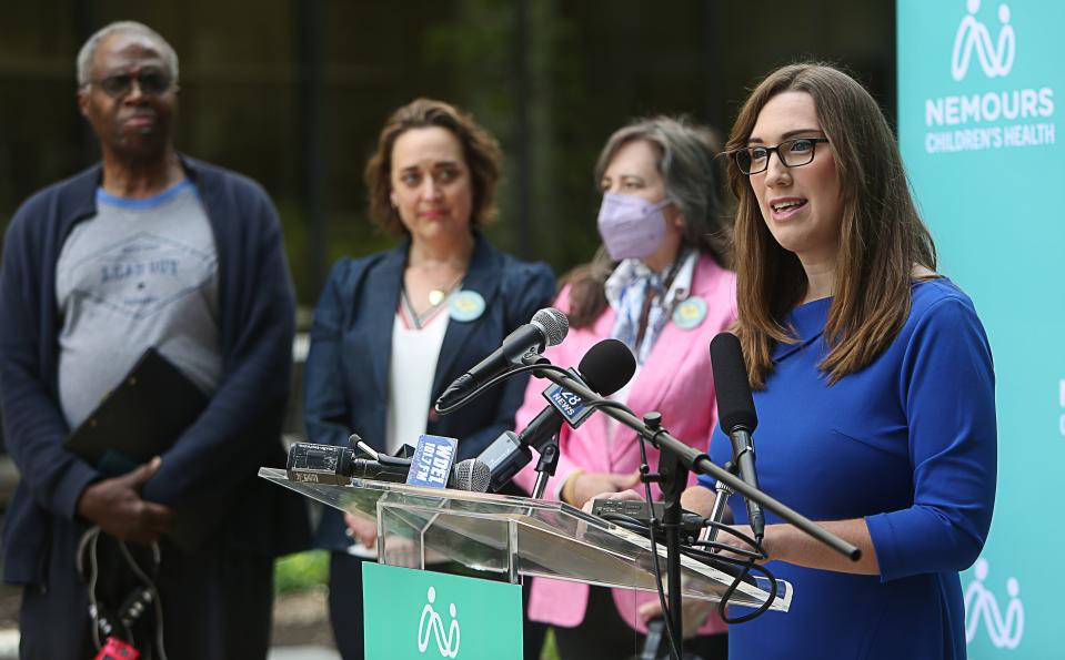 State Sen. Sarah McBride, right, speaks at a press conference on Monday, May 8, 2023, at the Nemours Children's Hospital where legislation was announced that hopes to address lead remediation in homes and schools.