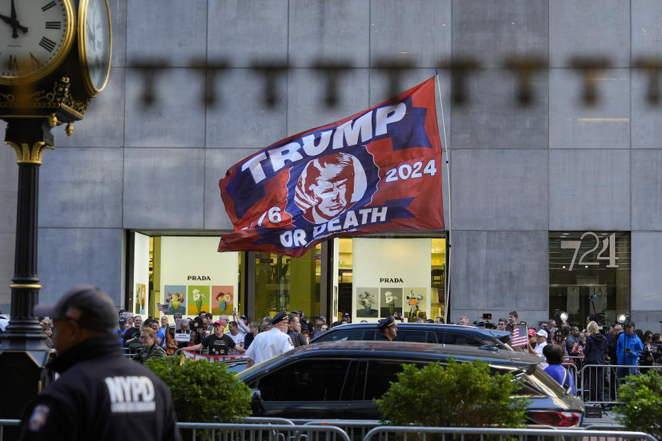 A crowd gathers across the street from Trump Tower, Friday, May 31, 2024, in New York. A day after a New York jury found Donald Trump guilty of 34 felony charges, the presumptive Republican presidential nominee will address the conviction and likely attempt to cast his campaign in a new light. (AP Photo/Julia Nikhinson)