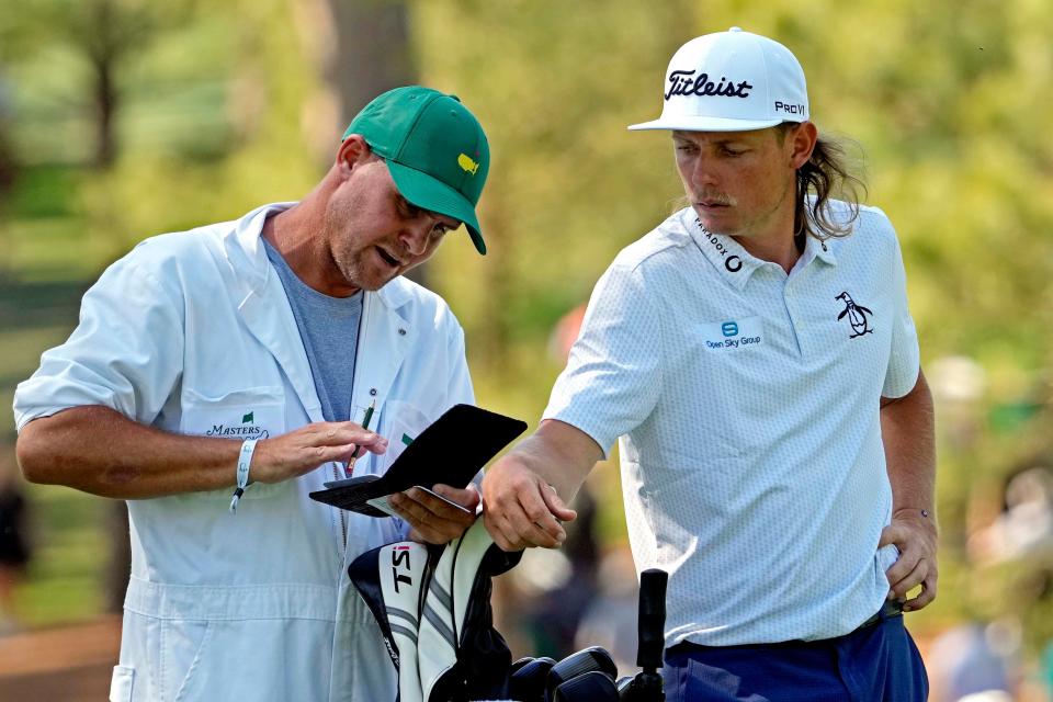 Cameron Smith talks with his caddie, Sam Pinfold, on the 18th hole Thursday. Smith double-bogeyed the hole and is in second place. Michael Madrid-USA TODAY Sports