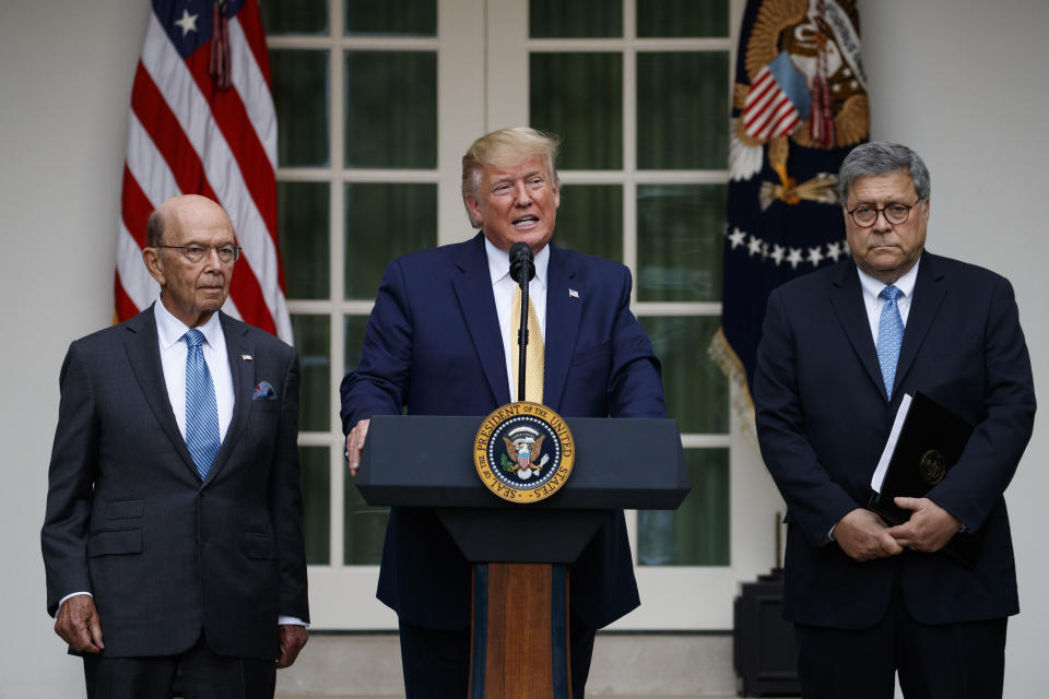 President Donald Trump, joined by Commerce Secretary Wilbur Ross, left, and Attorney General William Barr, speaks during an event about the census in the Rose Garden at the White House in Washington, Thursday, July 11, 2019. (AP Photo/Carolyn Kaster)