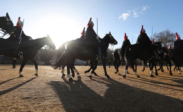 <p>Philip Toscano/PA Images via Getty</p> Members of the Household Cavalry at the changing of The Queen's Life Guard in London.