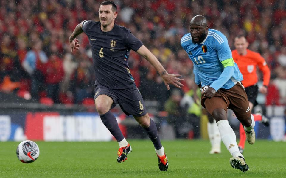 Lewis Dunk (L) of England in action against Romelu Lukaku (R) of Belgium