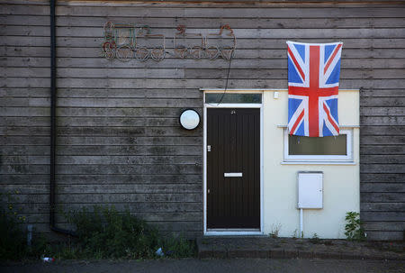 A union flag is displayed on a house at Jaywick near Clacton-on-Sea, a town in eastern England, where 70 percent of people voted on June 23, 2016 to leave the European Union, Britain August 23, 2016. REUTERS/Neil Hall/Files