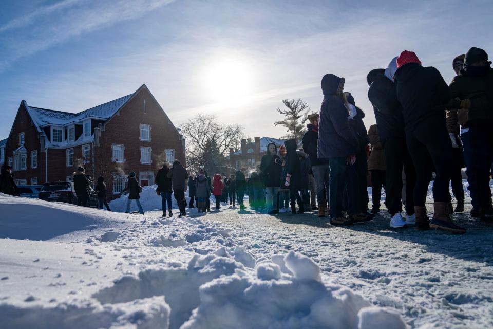 Hundreds wait in sub-zero temperatures to attend a rally for Former President Donald Trump, Sunday, Jan. 14, 2024, at Simpson College in Indianola, Iowa.