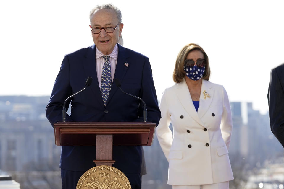 Senate Majority Leader Chuck Schumer of N.Y., speaks as House Speaker Nancy Pelosi of Calif., holds an enrollment ceremony for the $1.9 trillion COVID-19 relief bill, on Capitol Hill, Wednesday, March 10, 2021, in Washington. (AP Photo/Alex Brandon)