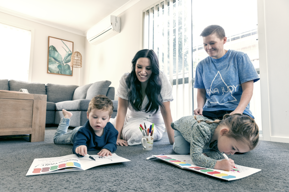 Truganina family Kayla Crea and Stacey Hope playing with their twins at their home.