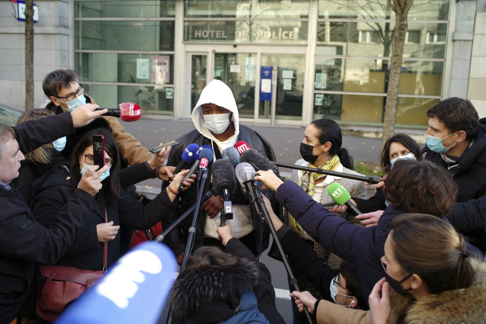 Music producer identified only by his first name, Michel, answers to media, before going to the Inspectorate General of the National Police, known by its French acronym IGPN, in Paris, Thursday, Nov. 26, 2020. French Interior Minister Gerald Darmanin ordered several Paris police officers suspended after the publication of videos showing them beating up a Black man and using tear gas against him with no apparent reason. (AP Photo/Thibault Camus)