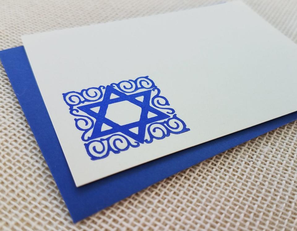 <p><a href="https://go.redirectingat.com?id=74968X1596630&url=https%3A%2F%2Fwww.etsy.com%2Flisting%2F518905046%2Fornate-jewish-star-letterpressed-small&sref=https%3A%2F%2Fwww.veranda.com%2Fhome-decorators%2Fg29293956%2Fhanukkah-decorations%2F" rel="nofollow noopener" target="_blank" data-ylk="slk:Shop Now;elm:context_link;itc:0;sec:content-canvas" class="link ">Shop Now</a></p><p>Ornate Jewish Star Letterpressed Small Flat Card</p><p>Etsy</p>