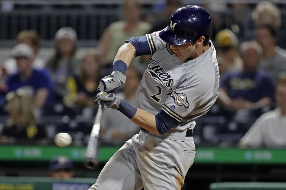 Milwaukee Brewers' Christian Yelich hits a solo home run off Pittsburgh Pirates relief pitcher Geoff Hartlieb during the ninth inning of a baseball game in Pittsburgh, Monday, Aug. 5, 2019. (AP Photo/Gene J. Puskar)