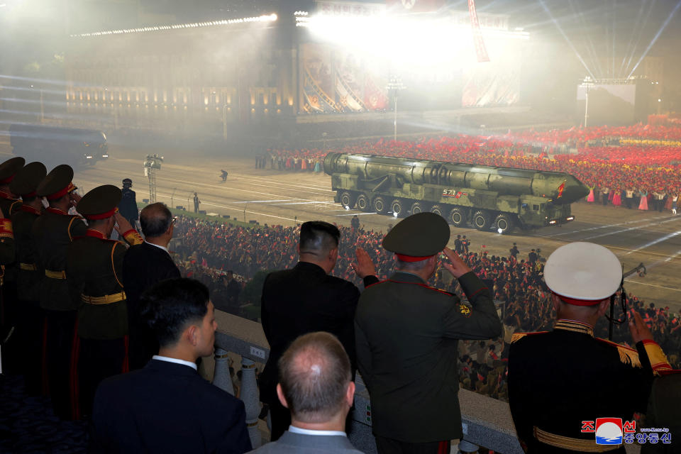 North Korean, Chinese and Russian officials watch the 'Victory Day' parade.