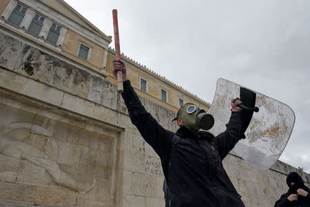 A protester gestures after clashes with police officers during a demonstration against the agreement reached by Greece and Macedonia to resolve a dispute over the former Yugoslav republic's name, in Athens, Greece, January 20, 2019. REUTERS/Alexandros Avramidis