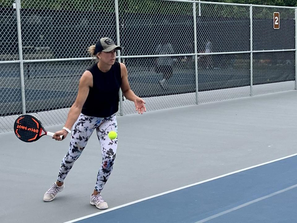 Katsiaryna Lukomskaya returns a serve in a National Beach Pop Tennis match at Ron Parker Park during Memorial Day weekend.