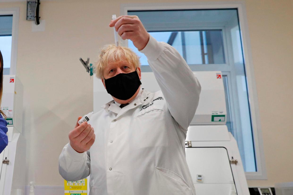 <p>Testing times:  Boris Johnson  visits a Public Health England testing facility in Porton Down today</p> (AFP via Getty Images)