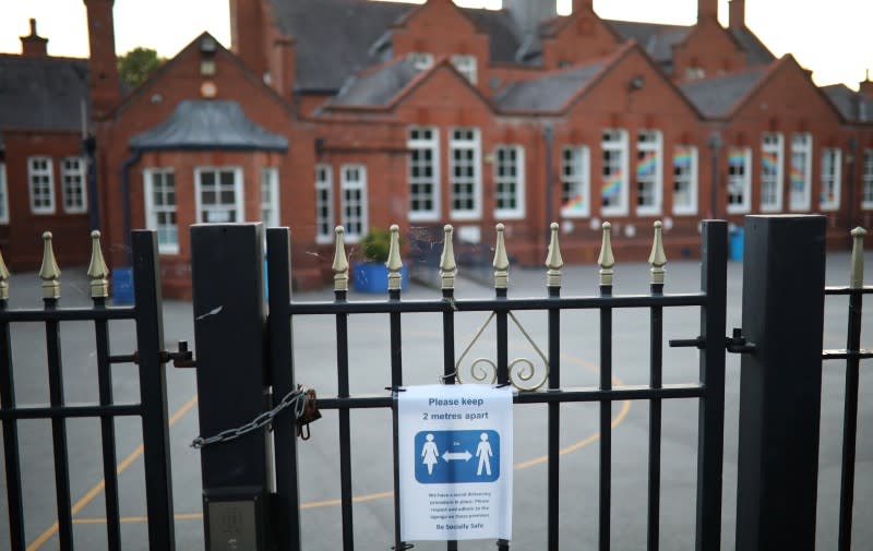 A social distancing sign is seen on the gate of a school as the spread of the coronavirus disease (COVID-19) continues in Hale