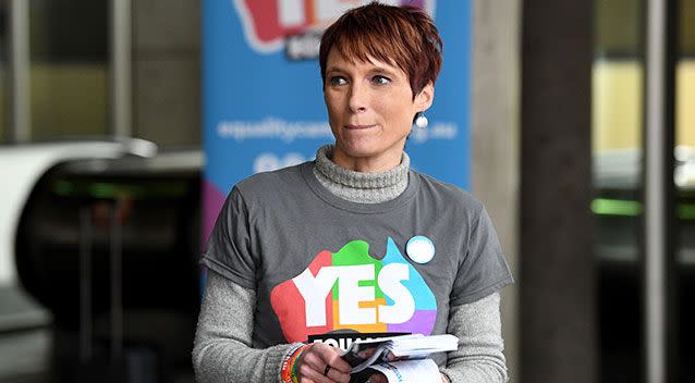 A supporter of same sex marriage stands outside the High Court in Melbourne on Thursday. Source: AAP