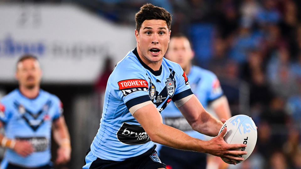 Pictured here, Mitch Moses gets set to throw a pass for NSW in Origin III.