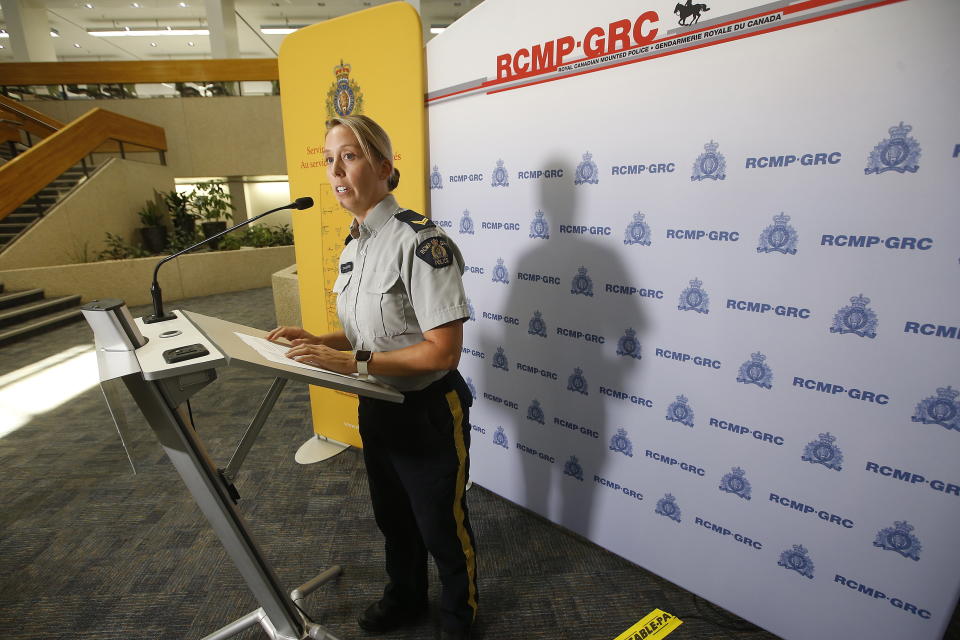 Royal Canadian Mounted Police Cpl. Julie Courchaine speaks to media about the ongoing RCMP search in Gillam, Manitoba, for the British Columbia murder suspects Bryer Schmegelsky and Kam McLeod, in Winnipeg, Manitoba, Friday, July 26, 2019. Gillam is more than 2,000 miles from northern British Columbia, where the three people were found slain. (John Woods/The Canadian Press via AP)