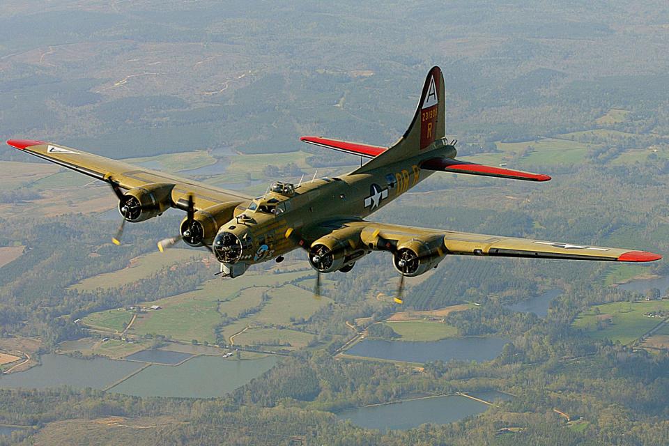 In this April 2, 2002, file photo, the Nine-O-Nine, a Collings Foundation B-17 Flying Fortress, flies over Thomasville, Ala., during its journey from Decatur, Ala., to Mobile, Ala. A B-17 vintage World War II-era bomber plane crashed Wednesday, Oct. 2, 2019,  just outside New England's second-busiest airport, and a fire-and-rescue operation was underway, official said. Airport officials said the plane was associated with the Collings Foundation, an educational group that brought its 
