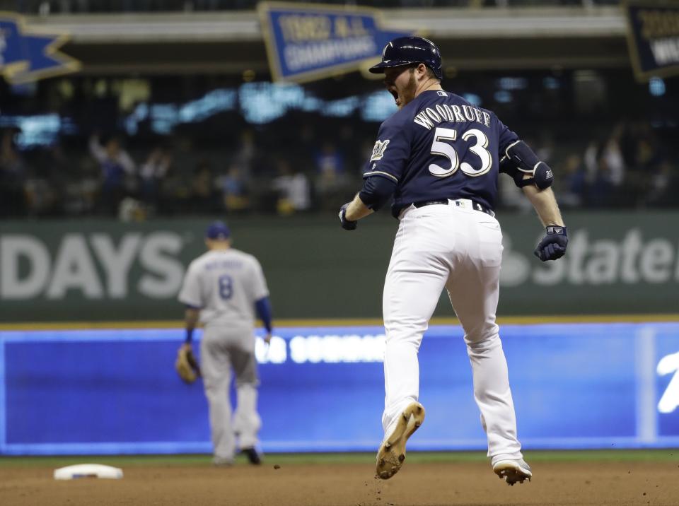 Milwaukee Brewers' Brandon Woodruff reacts after hitting a home run during the third inning of Game 1 of the National League Championship Series baseball game against the Los Angeles Dodgers Friday, Oct. 12, 2018, in Milwaukee. (AP Photo/Matt Slocum)