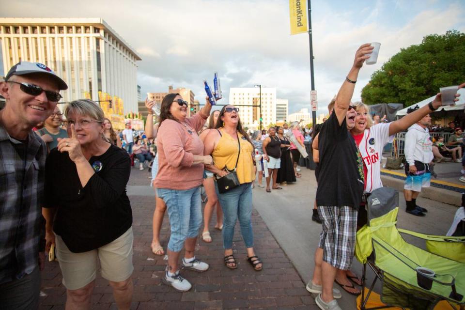 Riverfest attendees sing along with Tag Team during “Oweeo.” The hip-hop duo played other hit songs, such as “Whoomp! (There It Is).”