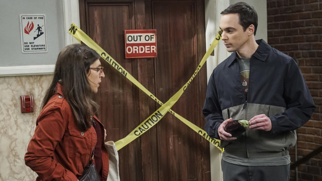  Jim Parsons and Mayim Bialik talk outside the elevator as Sheldon and Amy. 