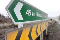 Road signs and the surrounding area are coated in ash on state highway one after Mt Tongariro erupted for the first time in over 100 years on August 7, 2012 in Tongariro National Park, New Zealand. Mt Tongariro erupted intermittently from 1855 to 1897. Although not an immediate threat to the community, the latest eruption may be the beginning of weeks, months or even years of volcanic activity. (Photo by Hagen Hopkins/Getty Images)