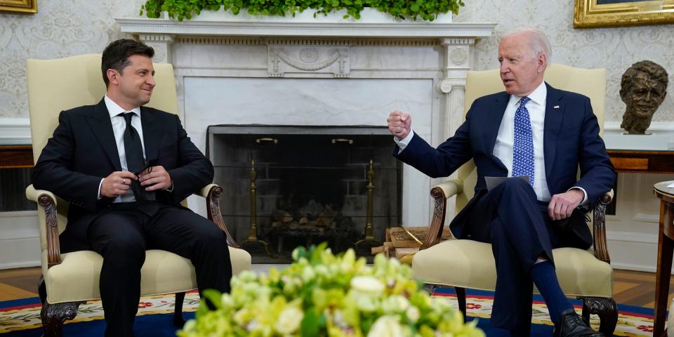 Joe Biden and Volodymyr Zelenskyy sit in the Oval Office.