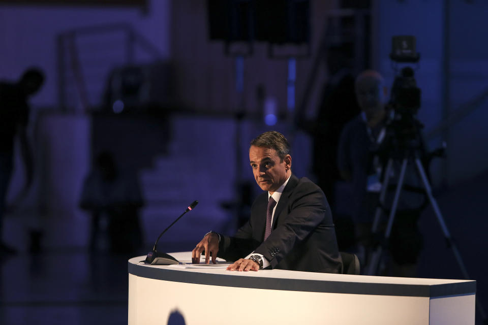 Greece's Prime Minister Kyriakos Mitsotakis addresses reporters during a news conference at the Thessaloniki International Fair, at the northern city of Thessaloniki, Sunday, Sept. 8, 2019. Greece's prime minister said on Saturday that financial reforms such as reducing taxes, fighting bureaucracy and attracting investment must be implemented before the country asks its creditors to agree to lower budget surpluses. (AP Photo/Giannis Papanikos)